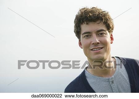 Stock Image - Young man, portrait. Fotosearch