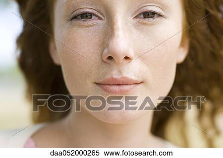 Stock Photography - Young red-haired woman, portrait. Fotosearch