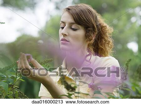 Young woman gardening View Large Photo Image Stock Image - Young woman gardening. Fotosearch