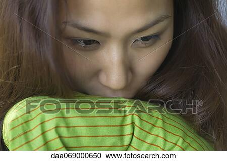 Young woman holding pillow View Large Photo Image Stock Image - Young woman holding pillow. Fotosearch