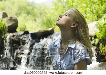 Young woman in nature View Large Photo Image Stock Photography - Young woman in nature. Fotosearch