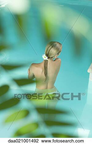 Young woman in pool, topless, rear view View Large Photo Image Stock Image - Young woman in pool, topless, rear view. Fotosearch