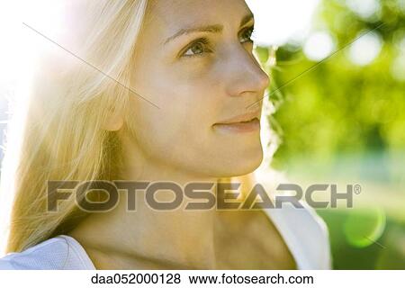 Young woman in sunlight, portrait View Large Photo Image Stock Photo - Young woman in sunlight, portrait. Fotosearch