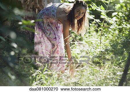 Young woman in woods View Large Photo Image Stock Image - Young woman in woods. Fotosearch