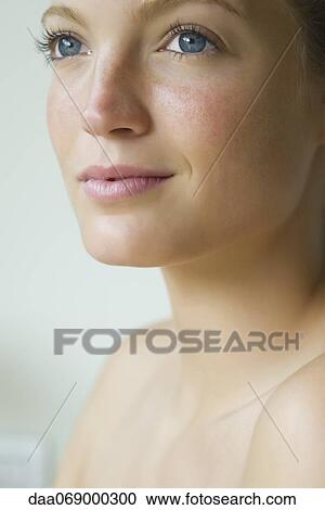 Young woman looking away in thought, portrait View Large Photo Image Stock Image - Young woman looking away in thought, portrait. Fotosearch
