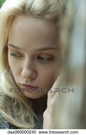 Young woman looking away sadly View Large Photo Image Stock Image - Young woman looking away sadly. Fotosearch