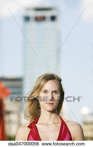 Stock Photograph - Young woman outdoors, portrait. Fotosearch