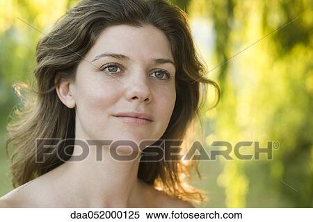 Stock Photography - Young woman outdoors, portrait. Fotosearch