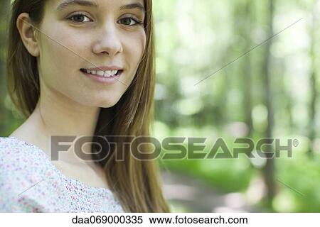Young woman outdoors, portrait View Large Photo Image Stock Photography - Young woman outdoors, portrait. Fotosearch