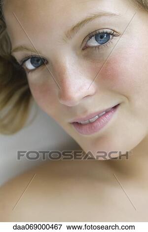 Stock Photo - Young woman relaxing, portrait. Fotosearch