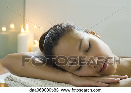 Young woman resting head on arms in bath View Large Photo Image Stock Image - Young woman resting head on arms in bath. Fotosearch