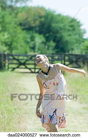 Young woman running on rural path with head back, eyes closed View Large Photo Image Stock Photo - Young woman running on rural path with head back, eyes closed. Fotosearch