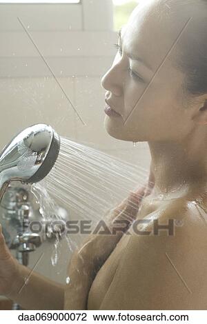 Young woman showering View Large Photo Image Stock Image - Young woman showering. Fotosearch