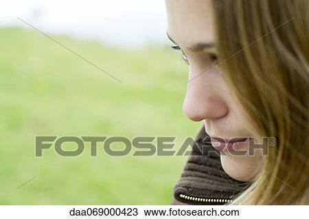 Young woman, side view View Large Photo Image Stock Image - Young woman, side view. Fotosearch