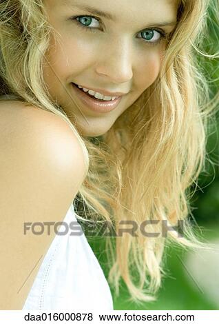Young woman smiling, head and shoulders, portrait View Large Photo Image Stock Photo - Young woman smiling, head and shoulders, portrait. Fotosearch