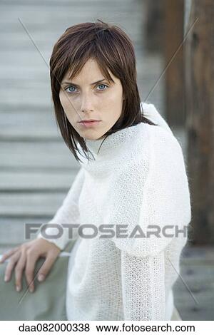 Young woman staring at camera, portrait View Large Photo Image Stock Photo - Young woman staring at camera, portrait. Fotosearch