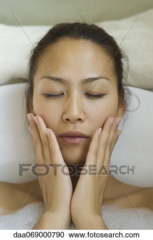 Young woman taking bubble bath View Large Photo Image Stock Image - Young woman taking bubble bath. Fotosearch