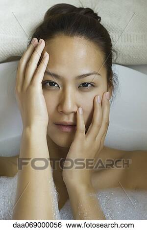 Young woman taking bubble bath View Large Photo Image Stock Photograph - Young woman taking bubble bath. Fotosearch