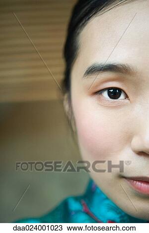 Young woman wearing traditional Chinese clothing, close-up of face, cropped View Large Photo Image Stock Image - Young woman wearing traditional Chinese clothing, close-up of face, cropped. Fotosearch