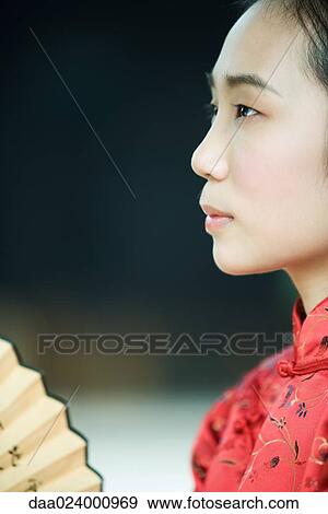 Young woman wearing traditional Chinese clothing, profile View Large Photo Image Stock Photo - Young woman wearing traditional Chinese clothing, profile. Fotosearch
