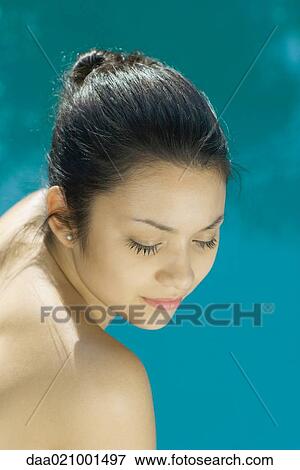 Young woman with bare shoulders, head and shoulders, portrait, high angle view View Large Photo Image Stock Photo - Young woman with bare shoulders, head and shoulders, portrait, high angle view. Fotosearch