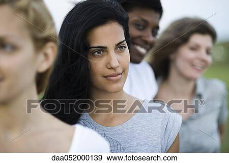 Young woman with friends, portrait View Large Photo Image Stock Photo - Young woman with friends, portrait. Fotosearch