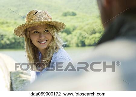 Young woman with straw hat View Large Photo Image Stock Image - Young woman with straw hat. Fotosearch