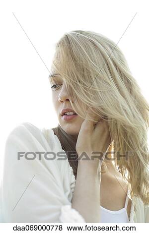 Young woman with tousled hair looking sad, portrait View Large Photo Image Stock Photo - Young woman with tousled hair looking sad, portrait. Fotosearch