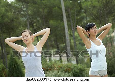 Stock Photography - Young women exercising outdoors. Fotosearch