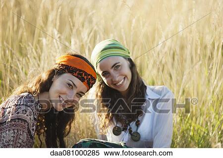 Stock Photography - Young women in grass. Fotosearch