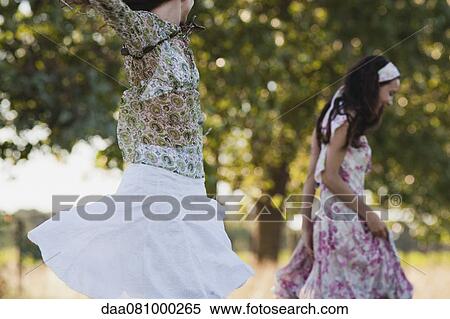 Young women running outdoors View Large Photo Image Stock Photography - Young women running outdoors. Fotosearch