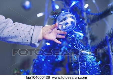Baby reaching for Christmas tree ornament View Large Photo Image Stock Photograph - Baby reaching for Christmas tree ornament. Fotosearch