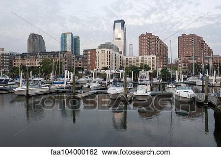 Stock Image - Boats docked in marina along waterfront, Jersey City, New Jersey, USA. Fotosearch