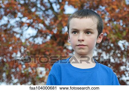 Boy contemplating outdoors, portrait View Large Photo Image Stock Image - Boy contemplating outdoors, portrait. Fotosearch