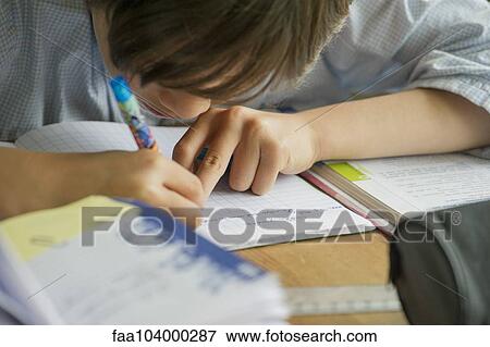 Boy doing homework View Large Photo Image Stock Photo - Boy doing homework. Fotosearch