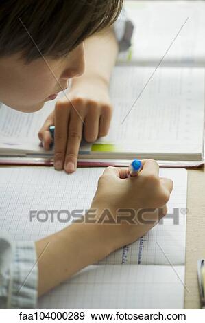 Boy doing homework View Large Photo Image Stock Photo - Boy doing homework. Fotosearch