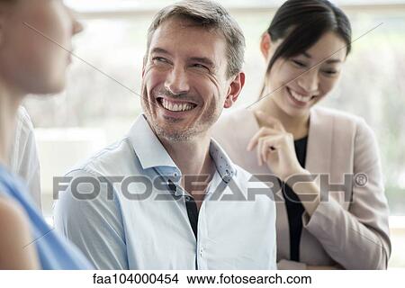 Business associates bonding View Large Photo Image Picture - Business associates bonding. Fotosearch