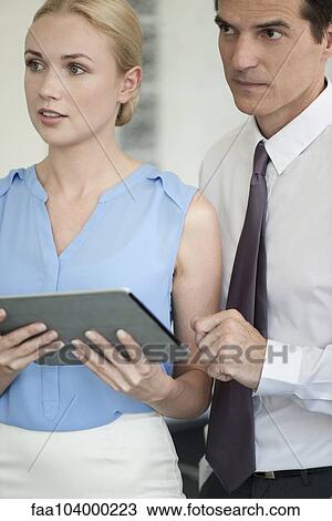 Stock Image - Business professionals at meeting. Fotosearch
