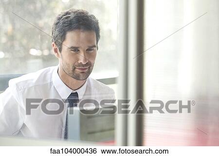 Businessman in office View Large Photo Image Stock Photograph - Businessman in office. Fotosearch