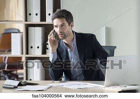 Businessman making important phone call View Large Photo Image Picture - Businessman making important phone call. Fotosearch