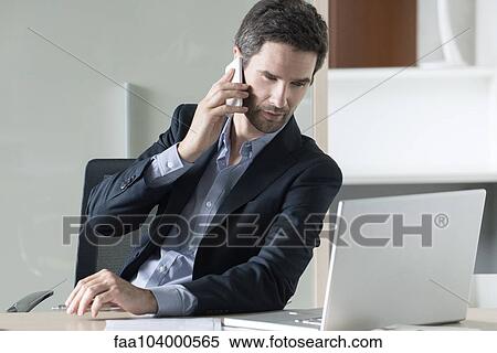 Stock Photography - Businessman making phone call. Fotosearch