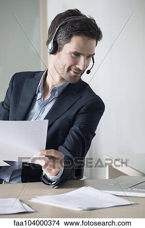 Businessman multitasking View Large Photo Image Picture - Businessman multitasking. Fotosearch