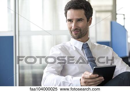 Businessman with digital tablet View Large Photo Image Stock Photography - Businessman with digital tablet. Fotosearch