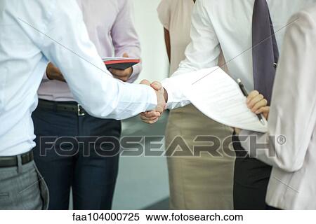 Stock Photography - Businessmen shaking hands. Fotosearch