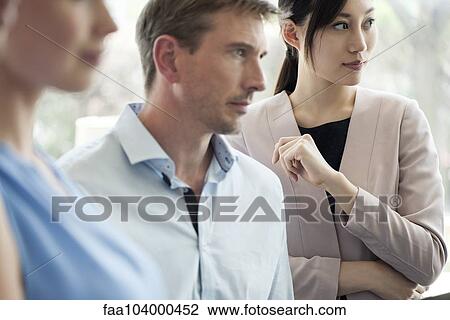 Businesswoman with colleagues at meeting View Large Photo Image Stock Image - Businesswoman with colleagues at meeting. Fotosearch