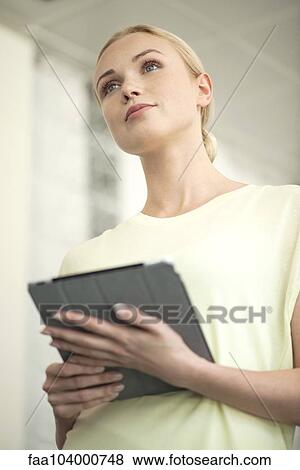 Businesswoman with digital tablet at presentation View Large Photo Image Stock Photo - Businesswoman with digital tablet at presentation. Fotosearch