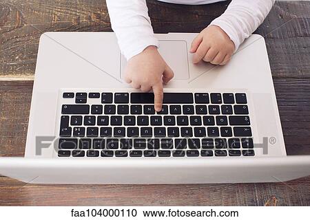 Child using laptop computer, cropped View Large Photo Image Stock Image - Child using laptop computer, cropped. Fotosearch
