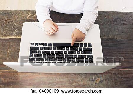 Child using laptop computer, cropped View Large Photo Image Stock Photo - Child using laptop computer, cropped. Fotosearch