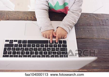 Child's hands on laptop computer keyboard View Large Photo Image Stock Image - Child's hands on laptop computer keyboard. Fotosearch
