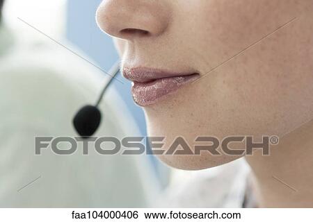 Close-up of operator wearing headset View Large Photo Image Stock Photograph - Close-up of operator wearing headset. Fotosearch